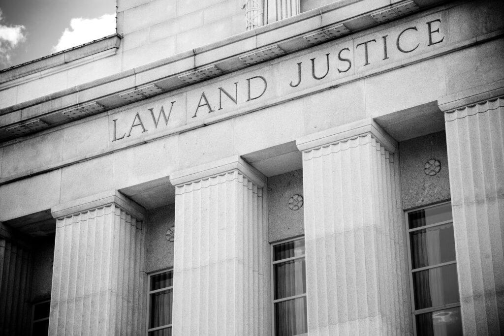 Scales of law and justice representing court-qualified forensic DNA expert testimony